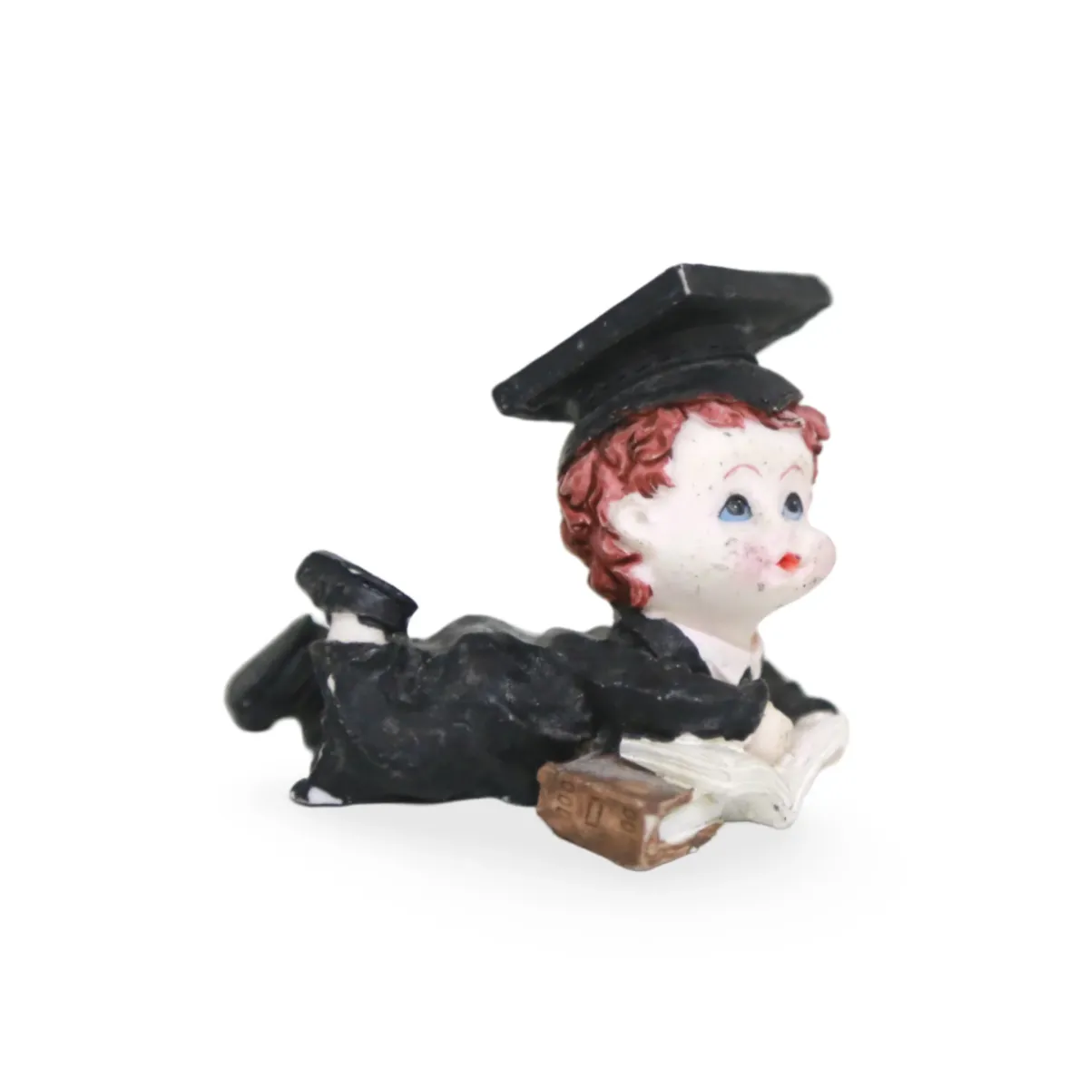Sleeping Graduated Boy Figure – 8″ Resting Graduate Statue in Cap & Gown, Whimsical Graduation Decor & Gift for 2024 Grads